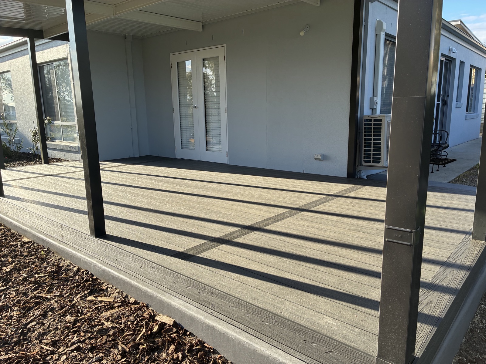Composite deck with French doors built by NPD Building Solutions